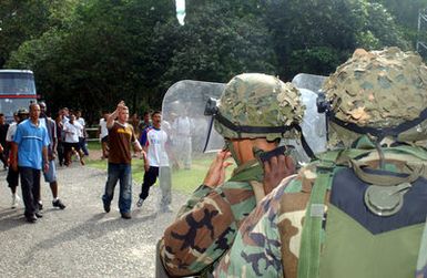 US Marine Corps (USMC) personnel and Royal Thai Marines stop non friendly nation mock protesters in their attempt to stop friendly nation evacuees from reaching the mock embassy during a Non-Combatant Evacuation Operation (NEO), part of Exercise COBRA GOLD 2003. The US Marine Corps (USMC) personnel are attached to 1ST Battalion, 3rd Marines home based from Hawaii