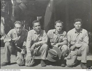 PORT MORESBY, PAPUA. C. 1943. RAAF AND USA AIRMEN WHO FLY TOGETHER AS THE CREW OF AN AMERICAN B-25 MITCHELL BOMBER AIRCRAFT. RAAF MEMBER IDENTIFIED BY WEARING OF WINGS INSIGNIA OVER LEFT BREAST