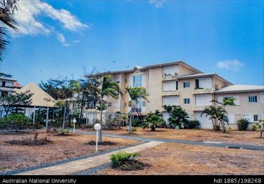 New Caledonia - peach multi-storey building with gardens