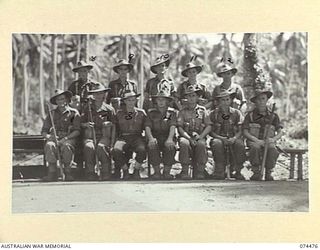 MADANG, NEW GUINEA. 1944-07-03. PERSONNEL OF THE INTELLIGENCE SECTION, 24TH INFANTRY BATTALION. IDENTIFIED PERSONNEL ARE:- PRIVATE L.E. PURVIS (1); CORPORAL J.F. RUSSELL (2); VX113767 LIEUTENANT ..