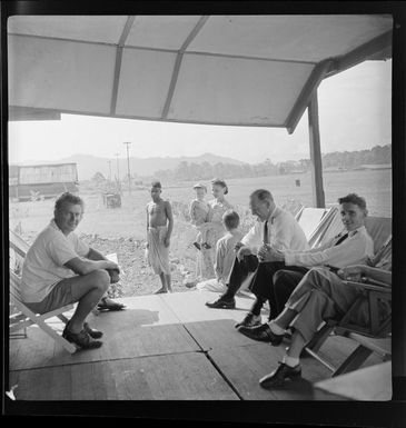 Qantas Lae office staff, Mrs Loney holding John, Captain J Brodie, first officer A McPhee, Papua New Guinea