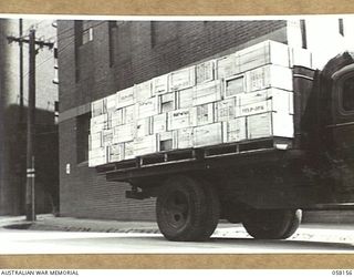 KENSINGTON, VIC. 1943-10-23. A TRUCK LOAD OF FLOUR ON PELLETS LEAVING THE MILLS OF MESSRS KIMPTON AND SONS FOR DESPATCH BY SHIP TO THE TROOPS IN NEW GUINEA