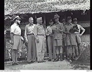GUADALCANAL, BRITISH SOLOMON ISLANDS PROTECTORATE. 1944-01-25. THE BRITISH RESIDENT COMMISSIONER, SOLOMONS, COLONEL OWEN NOEL, SPEAKING AT A CEREMONY WHERE LOCAL NATIVES PRESENTED A PLAQUE TO THE ..
