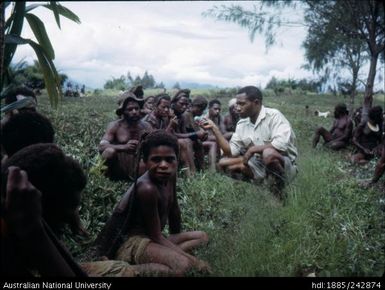 People seated in the grass