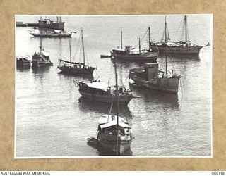 NAPA NAPA, NEW GUINEA. 1943-11-12. SMALL CRAFT STANDING OFF THE 1ST AUSTRALIAN WATERCRAFT WORKSHOPS, AUSTRALIAN ELECTRICAL AND MECHANICAL ENGINEERS