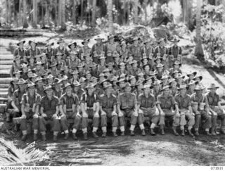 MADANG, NEW GUINEA. 1944-06-17. GROUP PORTRAIT OF OFFICERS AND OTHER RANKS OF D COMPANY, 58/59TH INFANTRY BATTALTION. LEFT TO RIGHT: FRONT ROW: VX113048 SERGEANT K. ROBERTSON; SX2311 WARRANT ..