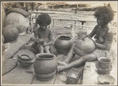 [Woman and child] making clay pots, Hanuabada, Papua New Guinea