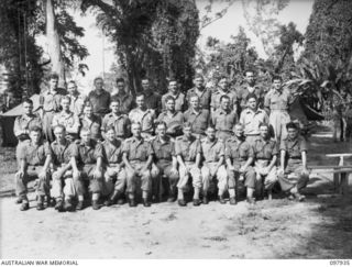 Torokina, Bougainville. 1945-10-12. Group portrait of the members of Regimental Headquarters, 2/11th Field Regiment. Left to right, back row: NX162480 Gunner (Gnr) T. G. Cheek of Newcastle, NSW; ..