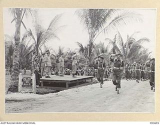 JACQUINOT BAY, NEW BRITAIN, 1945-07-01. HIS ROYAL HIGHNESS, THE DUKE OF GLOUCESTER, GOVERNOR-GENERAL OF AUSTRALIA (1), ADDRESSING THE TROOPS AT WUNUNG AIRSTRIP DURING HIS VISIT TO HEADQUARTERS 4 ..