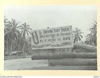 MILNE BAY, NEW GUINEA. 1943-03. A VERY PERTINENT NOTICE ERECTED ON THE TAXIWAY OF A ROYAL AUSTRALIAN AIR FORCE "TOMAHAWK" SQUADRON BASED ON GURNEY'S STRIP