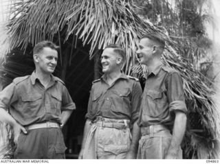 YAMIL 2, NEW GUINEA, 1945-08-01. CAPTAIN J.C. WALKER, ADJUTANT 2/6 INFANTRY BATTALION; LIEUTENANT COLONEL F.G. WOOD, CO 2/6 INFANTRY BATTALION; LIEUTENANT L.G. GRANT, INTELLIGENCE OFFICER 2/6 ..