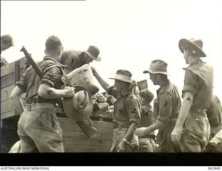 Port Moresby, New Guinea. Troops of the 58/59th Australian Infantry Battalion, 15th Brigade, Australian Military Forces, preparing to be airlifted to Dumpu to relieve a unit of the 21st Brigade, ..