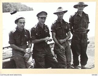 NANTAMBU, NEW BRITAIN. 1945-07-26. NEW GUINEA INFANTRY BATTALION OFFICERS ON THE JETTY. IDENTIFIED PERSONNEL ARE:- LIEUTENANT D. CHRISP (1); MAJOR A.R. TOLMER (2); CAPTAIN J.H. KEFT (3); CAPTAIN ..
