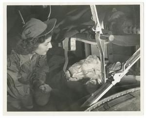 [Jane Kendeigh with Injured Soldier on Flight]