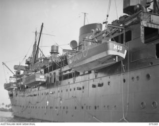 ALEXISHAFEN, NEW GUINEA. 1944-08-15. INVASION CRAFT SWINGING OFF THE DECK OF THE RAN ASSAULT SHIP, HMAS "MANOORA"