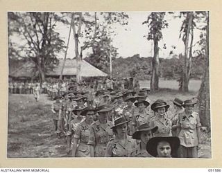 WIDE BAY, NEW BRITAIN, 1945-05-09. AUSTRALIAN WOMEN'S ARMY SERVICE AT HEADQUARTERS FIRST ARMY FILING INTO THE GARRISON CHAPEL FOR THE CHURCH OF ENGLAND AND OTHER PROTESTANT DENOMINATIONS ..