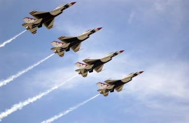 The U.S. Air Force Thunderbirds Aerial Demonstration Team F-16C Fighting Falcon aircraft perform during the Open House Air Show, Sept. 12, 2004, at Andersen Air Force Base, Guam. (U.S. Air Force PHOTO by AIRMAN 1ST Class Kristin Ruleau). (Released)