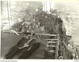 PURIATA RIVER AREA, BOUGAINVILLE ISLAND. 1944-12-31. AMERICAN ARMY PERSONNEL FIRING A BOFORS 40MM ANTI-AIRCRAFT GUN ON ENEMY SHORE INSTALLATIONS FROM AN LANDING CRAFT INFANTRY DURING A JOINT NAVAL ..