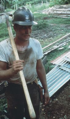 Builder 2nd Class (BU2) Todd Heck, a member of Naval Mobile Construction Battalion 62, works at a construction site while helping to rapair damage caused by Cyclone Uma