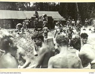 TOKO, BOUGAINVILLE, SOLOMON ISLAND. 1945-03-26. VX1 GENERAL SIR THOMAS BLAMEY, GBE, KCB, CMG, DSO, ED, COMMANDER- IN- CHIEF, ALLIED LAND FORCES, SOUTH WEST PACIFIC AREA (1), WITH SENIOR OFFICERS AT ..
