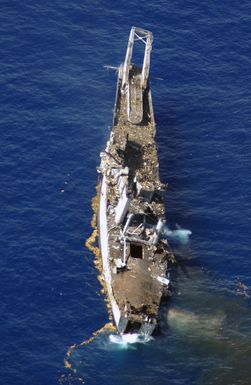 The USS SCHENECTADY, a 522-foot tank landing ship that was decommissioned in 1993, lists after being hit by seven 2,000 Joint Defense Attack Munitions (JADAM) missiles during exercise Resultant Fury at the Pacific Missile Range Facility off the Island of Kauai, Hawaii, on Nov. 23, 2004. (USAF PHOTO by TECH. SGT. Richard Freeland) (Released)