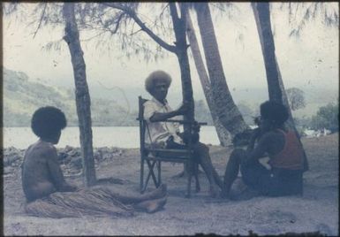 Meeting at village to explain anti-malaria house-spraying campaign : D'Entrecasteaux Islands, Papua New Guinea, 1956-1959 / Terence and Margaret Spencer