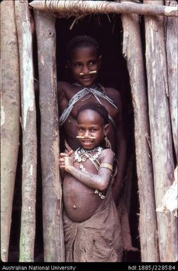 Febi girls at the doorway of their house