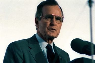 President George Bush speaks from the Kilo 8 Pier during the observance of the 50th anniversary of the Japanese attack on Pearl Harbor