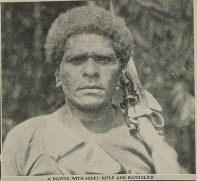 A native with hides' rifle and bandolier