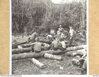 FINSCHHAFEN AREA, NEW GUINEA. 1943-11-11. TROOPS OF THE 2/3RD AUSTRALIAN PIONEER BATTALION BUILDING A BRIDGE ACROSS A CREEK ON THE NEW ROAD BETWEEN SCARLET BEACH AND SIMBANG