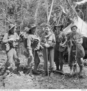 NEW GUINEA, 1943-07-27. STRETCHER BEARERS OF "D" COMPANY 2/5TH BATTALION. LEFT TO RIGHT:- VX24888 PRIVATE J. C. YOUNG; VX12513 CORPORAL L. C. ALLEN MM; CAPTAIN L. A. INGRISAND (DOCTOR), UNITED ..