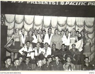 BOUGAINVILLE ISLAND. 1945-01-27. THE ENTIRE CAST OF THE 58/59TH INFANTRY BATTALION PLAYERS ON THE STAGE AT THE CONCLUSION OF THE CONCERT STAGED AT THE 2ND AUSTRALIAN CORPS HEADQUARTERS