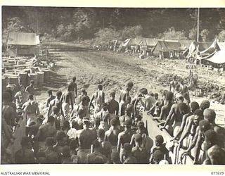 JACQUINOT BAY, NEW BRITAIN. 1944-12-13. AUSTRALIAN NEW GUINEA ADMINISTRATIVE UNIT NATIVES DISEMBARKING FROM AN LANDING CRAFT MECHANISED (LCM) AT THE MALMAL MISSION FOR THEIR DAY'S WORK IN THE 5TH ..