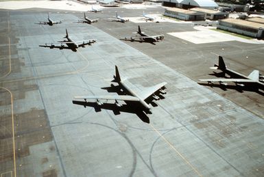 An aerial view of several B-52 Stratofortress aircraft parked on the flight line during exercise Giant Warrior '90