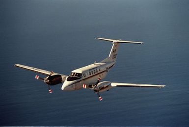 An aerial of a UC-12B Huron assigned to the Fleet Logistics Support Squadron 30 (VRC-30) Providers, stationed at Naval Air Station North Island (NASNI), California, in flight over the Pacific Ocean