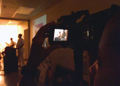 US Navy (USN) Photographer's Mate PETTY Officer 3rd Class (PH3) Lolita Swain, Fleet Combat Camera Group Pacific, used a digital camera to document a media briefing during the Ehime Maru recovery operations