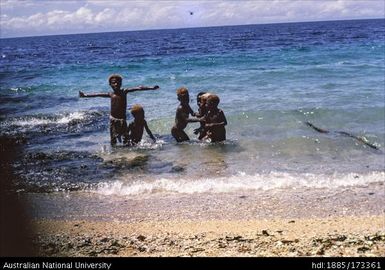 Children playing on Rakival beach