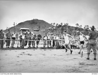 PORT MORESBY, NEW GUINEA. 1944-04-23. THE FINISH OF THE 220 YARDS RACE AT THE 2/101ST GENERAL TRANSPORT COMPANY SPORTS MEETING HELD AT 9 MILE. IDENTIFIED PERSONNEL ARE:- VX136458 PRIVATE E.R. MARK ..