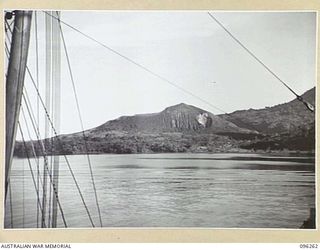 BLANCHE BAY, RABAUL, NEW BRITAIN. 1945-09-10. A VIEW OF MATUPI CRATER TAKEN FROM ONE OF THE SHIPS OF THE CONVOY ENTERING SIMPSON HARBOUR FOR THE OCCUPATION OF THE RABAUL AREA, FOLLOWING THE ..