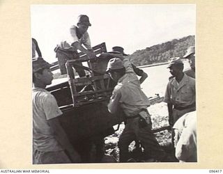 MUSCHU ISLAND, NEW GUINEA, 1945-09-11. JAPANESE PERSONNEL UNLOADING THEIR PERSONAL BELONGINGS AT MUSCHU ISLAND. AN ADVANCE PARTY OF 63 OFFICERS AND OTHER RANKS OF THE JAPANESE ARMY AND NAVY WAS ..