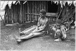 Yeria, Wanuma Census Division: woman and child next to house