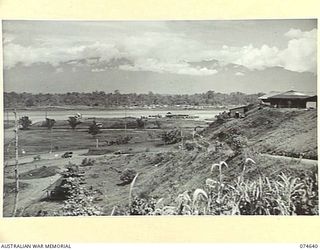 LAE. NEW GUINEA. 1944-07. ONE OF A NUMBER OF PHOTOGRAPHS TAKEN TO GIVE A 120 PANORAMIC VIEW OF THE TOWN OF LAE. TO JOIN TO PHOTOGRAPHS NO. 74635, 74636, 74637, 74638 AND 74639