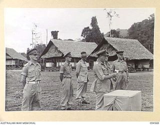 TOROKINA, BOUGAINVILLE, 1945-08-04. LIEUTENANT-GENERAL S.G. SAVIGE, GENERAL OFFICER COMMANDING 2 CORPS, ADDRESSING MEMBERS OF THE ROYAL PAPUAN CONSTABULARY. HE PRESENTED VALOUR MEDALS TO TWO NATIVE ..