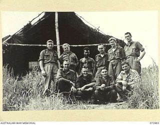 DUMPU, NEW GUINEA. 1944-04-20. PERSONNEL OF HEADQUARTERS 15TH INFANTRY BRIGADE. OUTSIDE THE OTHER RANKS' MESS. IDENTIFIED PERSONNEL ARE:- VX109123 PRIVATE F. HARDCASTLE (1); N212206 PRIVATE J.D. ..