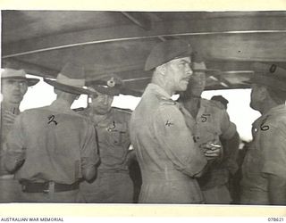 JACQUINOT BAY, NEW BRITAIN. 1945-01-12. MAJOR-GENERAL J.A. BAILLON OF THE BRITISH ARMY GENERAL STAFF, N373078 CHAPLAIN GENERAL A.M. STEVENSON, MC, ED, AND PARTY WITH VX27 MAJOR-GENERAL A.H. RAMSAY, ..