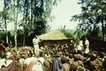 Electioneering in a Western Highland village, New Guinean candidate addressing voters, [Western Highlands], Jan 1964