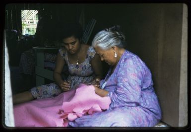Two women sewing a tivaevae, Rarotonga
