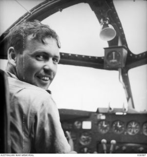 Portrait of 411756 Pilot Officer William A de Salis at the controls of his Lockheed Hudson aircraft (A16-246) of 6 Squadron RAAF during a mission. Although the Squadron was based at Horn Island, de ..