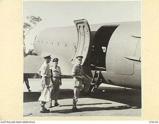 TOROKINA, BOUGAINVILLE ISLAND. 1944-12-15. NX35000 LIEUTENANT GENERAL V.A.H. STURDEE, CB, CBE, DSO, GOC, FIRST AUSTRALIAN ARMY (3) ABOUT TO ENTER THE RAAF DOUGLAS DAKOTA C47 AIRCRAFT WHICH IS TO ..