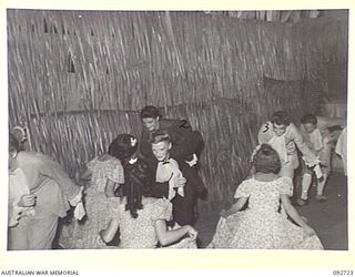 LAE AREA, NEW GUINEA. 1945-06-05. A CONCERT WAS GIVEN AT THE OPEN AIR THEATRE OF 2/7 GENERAL HOSPITAL. THE ENTERTAINERS WERE FROM STAFF OF 2/7 GENERAL HOSPITAL, LAE CHORAL GROUP AND THE LAE PLAY ..